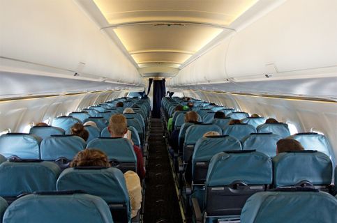 Astra Airlines Economy didalam foto